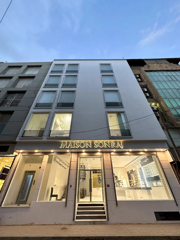 Modern building facade with 'MAISON SONRAJ' signage